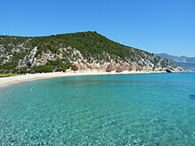 A video postcard introduced Andrea's performance in the second semi-final of the Eurovision Song Contest 2022. The postcard was filmed at the Cala Luna [it] in the Province of Nuoro in Sardinia and featured virtual projections of Andrea across the location. Cala Luna 2017.jpg