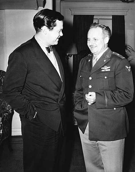 Orson Welles and Col. Arthur I. Ennis of the U.S. Department of War's Bureau of Public Relations discuss plans for the new radio series Ceiling Unlimi