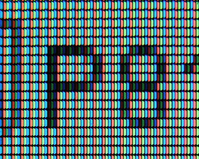 A photograph of subpixel display elements on a laptop's LCD screen