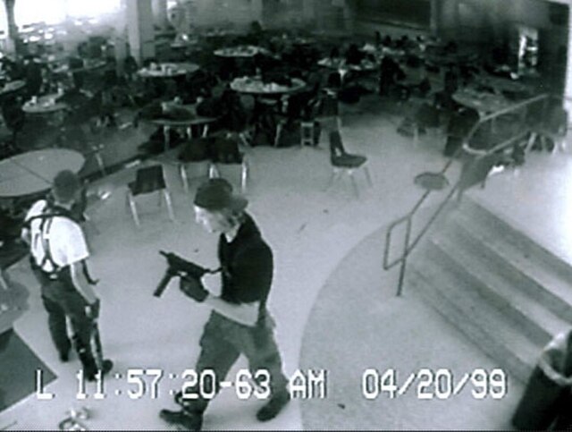 Harris (left) and Klebold (right) in the cafeteria, 8–11 minutes before their suicide in the library