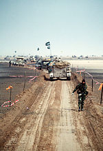 A column of Saudi M-113 armored personnel carriers taking part in Operation Desert Storm, 1991 DF-ST-92-08022-C.jpg