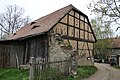 Residential stable house and two barns in a three-sided courtyard