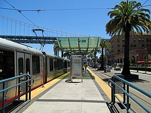 Embarcadero and Folsom station with train, July 2017.JPG