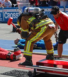 Forcible Entry-Competitor hitting 160 lb. beam with 9 lb. sledgehammer FFCC Forcible Entry.jpg