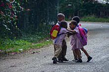 Fighting school kids Fighting after school in central Jamaica - all shoelaces are open (32361821164).jpg