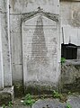 Headstone affixed to the north of St George in the East, built in 1729. [612]