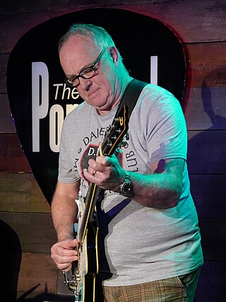 <span class="mw-page-title-main">Robbie McIntosh</span> English guitarist