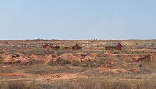 Miners' huts and tailings dump near Ilakaka IlakakaTailingsDump1.jpg