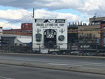 Modern Juniata Locomotive Shop sign viewed from Chestnut Avenue Juniata Locomotive Shop sign 2018.jpg
