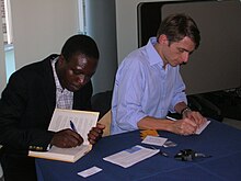 William Kamkwamba and Bryan Mealer signing books of "The Boy Who Harnessed the Wind" at Georgetown University.