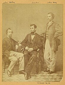 Abraham Lincoln and his secretaries John G. Nicolay and John Hay photographed by Alexander Gardner on November 8, 1863 in Washington, D.C. Lincoln & his secretaries, Nicolay & Hay photographed November 8 1863 by Alexander Gardner in Washington DC.jpg