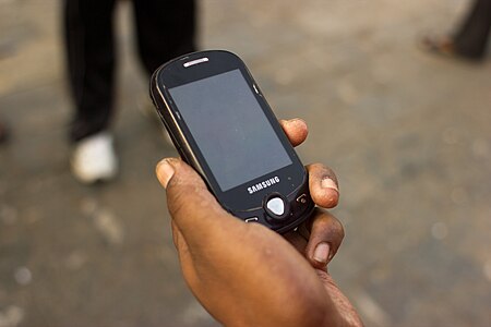 Mumbai Guy on Cellphone November 2011 -3-4 closeup.jpg