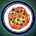 Pizza of tomato sauce, TVP, cheddar, black olives, and curry powder on soft taco - Massachusetts.jpg