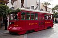 Red Car Trolley 623 with Christmas garland on front and News Boys riding.jpg