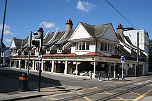 The northern buildings, photographed in 2008, and destroyed in 2011 Reeves furniture emporium, Reeves Corner - geograph.org.uk - 882614.jpg