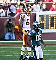 Washington Redskins' Santana Moss, left, makes a leaping catch in front of  New York Giants' Kevin Dockery in the second quarter, Sunday, December 16,  2007, at Giants Stadium in East Rutherford, New