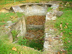 The excavated site of the south-eastern bastion of Fort Tanjong Katong at Katong Park, circa August 2006. The structure, part of the fort built by the British in 1879, was likely positioned to help soldiers get a good shot at lurking enemies Remains of Fort Tanjong Katong, Katong Park, Singapore - 20060826.jpg