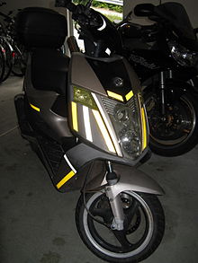 Flash photo of moped with Retroreflective sheeting tape Retroreflective sheeting on a moped.JPG