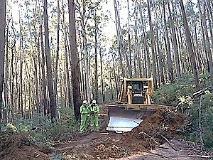 Clearing roads and tracks after winter snow and storms was major task. Road brushup.jpg