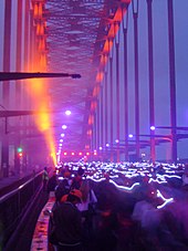 Walkers with LED caps on the bridge's 75th Anniversary SHB75.jpg