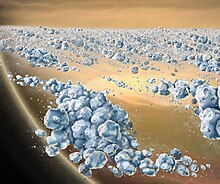 A 2007 artist impression of the aggregates of icy particles that form the 'solid' portions of Saturn's rings. These elongated clumps are continually forming and dispersing. The largest particles are a few meters across. Saturn Ring Material.jpg