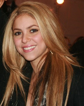 Colombian singer Shakira (pictured in 2009), the most awarded performer with nine wins Shakira2009.jpg