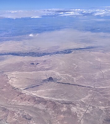 Aerial view of Shiprock and Shiprock Dike, with the San Juan River behind