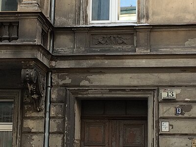 Detail of a cartouche motif at No.13