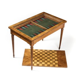 Games table with chess and backgammon boards exposed
