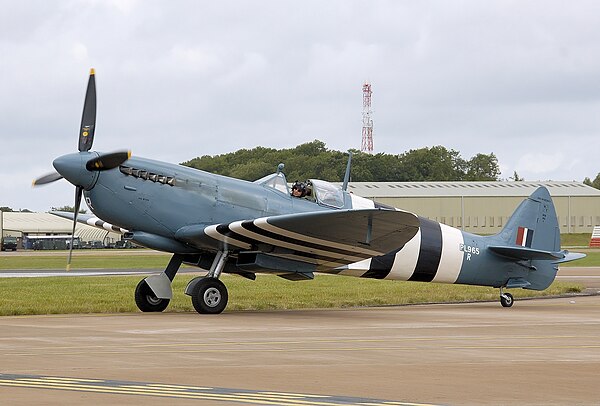 Photographic reconnaissance Spitfire PR Mk XI wearing 1944 invasion stripes.