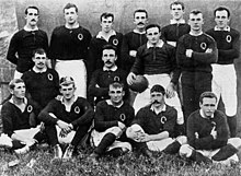 Queensland Rugby team 1899: Front row - F. Kent, S. Boland, W. Tannee, E. Currie, A. Colton. Centre - A. Gralton, C. S. Graham, R. McCowan (captain), T. Colton. Back row - W. Evans, P. Carew, T. Ward, W. H. Austin, A. Corfe, L. Dixon StateLibQld 1 49880 Battle-stained Queensland Rugby Union Team, photographed after the match in July 1899.jpg