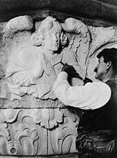 Stonemason finishing an angel, 1909 Stone sculptor at work.jpg