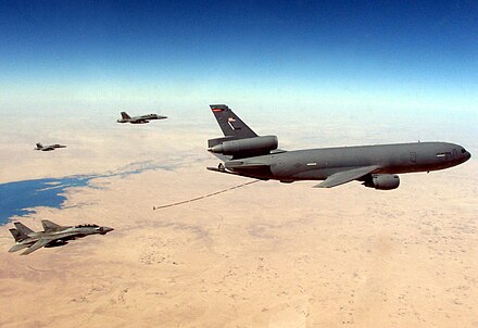 A US Navy F-14D and two F/A-18Cs prepare to refuel from a KC-10 in 2005 over the Persian Gulf.
