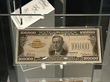 The $100,000 bill, a gold certificate from Series 1934, is the largest denomination banknote ever produced in the United States; it was printed to facilitate transactions between Federal Reserve Banks, and was never issued for usage by the public. United States one-hundred-thousand-dollar bill on display at the Smithsonian National Museum of American History, 7 February 2024.jpg