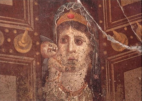 This mid-1st-century-BC Roman wall painting in Pompeii is probably a depiction of Cleopatra VII as Venus Genetrix, with her son Caesarion as Cupid. Its owner Marcus Fabius Rufus most likely ordered its concealment behind a wall in reaction to the execution of Caesarion on orders of Octavian in 30 BC.[165][166]