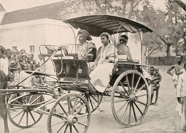 A 1908 photo of a bride and bridegroom of the sudra caste in a horse-drawn vehicle.