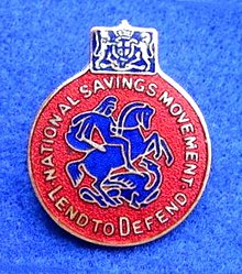 A World War II badge showing St. George and the Dragon and the slogan "Lend to Defend". World War II National Savings badge.jpg
