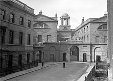 King's Inns courtyard at the turn of the 20th century "Classical building - location unknown" is Henrietta St, Dublin (33481350971).jpg