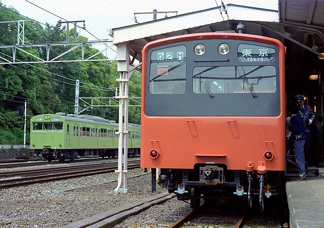 The prototype unit of JNR 201 series on public display at Harajuku Station in Tokyo, 13 May 1979. Next to it, a Yamanote Line's 103 series train can b