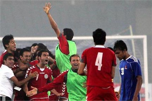 Players are celebrating after winning their 2011 SAFF Championship Semi-final against Nepal
