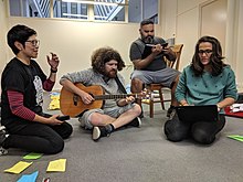 Actors and musician rehearsing a theatre project in MakeSpace Artists rehearsal.jpg