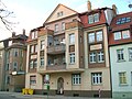 Apartment building in half-open development