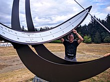 The equatorial sundial at Battle Point Park, Bainbridge Island, Washington, being admired by Fred Sammartino Battle Point Park sundial.jpg