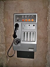 A telephone booth in France prior to the switch to the euro. Coins are Francs on the labels. It also uses the rotary dial and the 20 centimes coin, which means the device dates back to circa 1980. Cabine telephonique.JPG