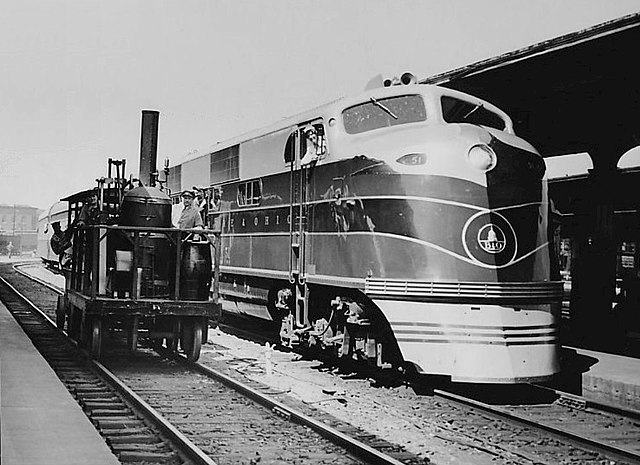 B&O EA 51 on the Capitol Limited sitting next to the Tom Thumb locomotive replica, in 1937.