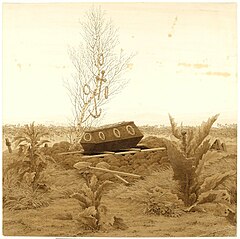 Coffin at the edge of a grave