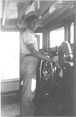 Ship's wheelhouse in 1942 Chief Body at the wheel of the Joyita.jpg