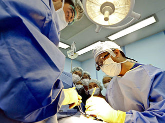 Cambodian medical students watching a surgery operation Defense.gov photo essay 120801-O-ZZ999-011.jpg