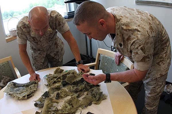 Pieces of a Kevlar helmet used to help absorb the blast of a grenade