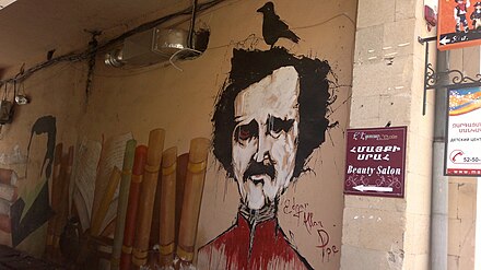 Colorful Edgar Allan Poe graffiti. And the beauty salon is this way.